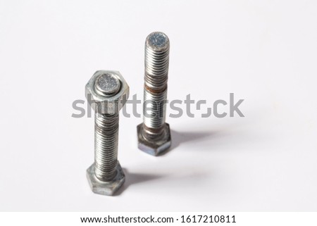 Rusty screw and nuts isolated on white background. Bolts and nuts