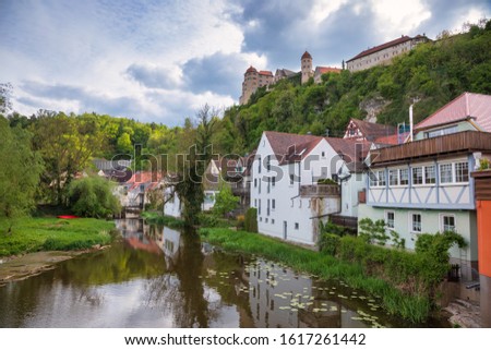 Gabled houses along the Wornitz river with Harburg Castle in background, Harburg, Swabia, Bavaria, Germany. Harburg is a popular destination on Romantic Road touristic route