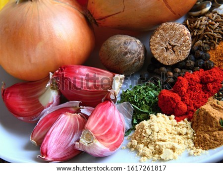 spicy ingredients including onions and peppers and garlic stock photo Royalty-Free Stock Photo #1617261817