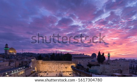 Western/Wailing Wall (Kotel) - holiest place in Judaism, and the Temple Mount with beautiful purple sunrise clouds; Jerusalem Israel Royalty-Free Stock Photo #1617304780