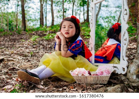 little girl snow white with apple
