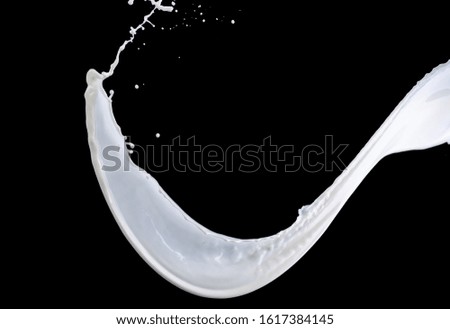 splash of milk on a black background