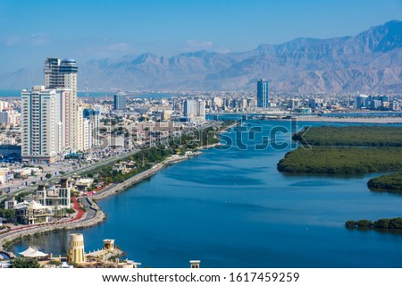 Aerial view of Ras al Khaimah, United Arab Emirates north of Dubai, looking at the city, , Jebal Jais - and along the Corniche. Royalty-Free Stock Photo #1617459259