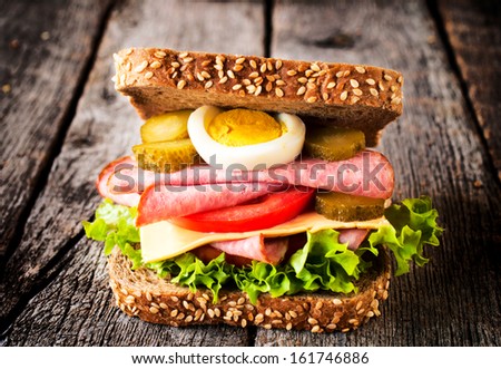 Single toast sandwich on the wooden background 