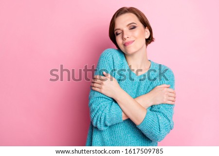 Close-up portrait of her she nice-looking attractive lovable sweet lovely cheerful cheery gentle brown-haired woman hugging herself isolated over pink pastel color background