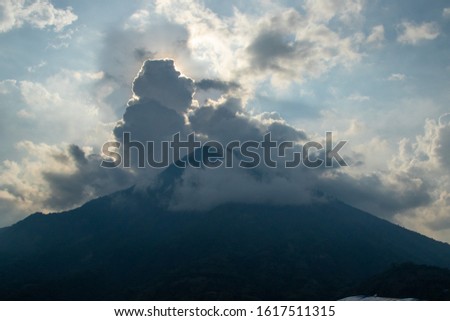 Detail of the clouds over volcanoes at sunset in Lake Atitlan Guatemala