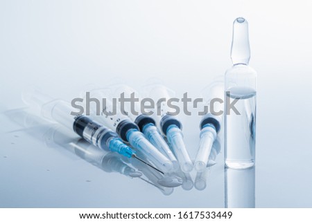 Syringes in clean medical background. Concept of injection drugs, medicine, vaccination or intravenous shots