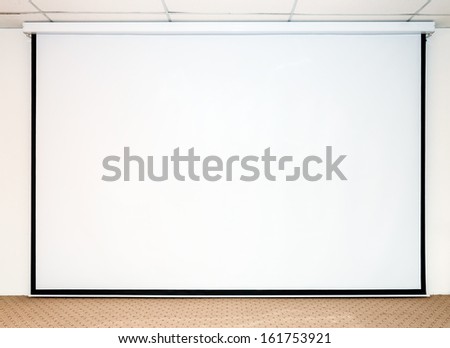 Large white screen for presentation on the stage.