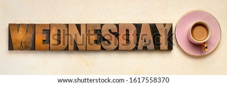 Wednesday  word typography - text in letterpress wood type printing blocks with a cup of coffee, the third day of the week and business concept
