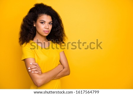 Close-up portrait of her she nice attractive lovely content calm serious focused wavy-haired girl folded arms isolated over bright vivid shine vibrant yellow color background