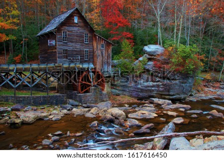 old mill at Babstock state park in west virginia with fall colors