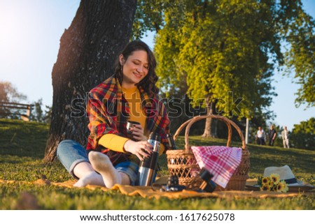 Woman enjoying coffee at the public park