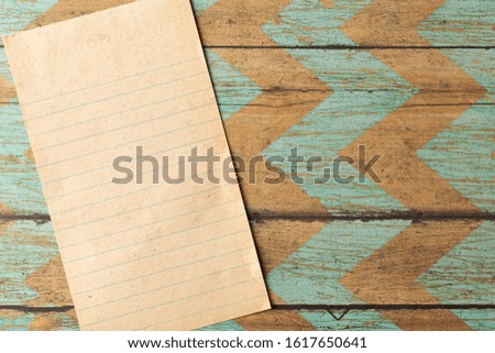 A Piece of Antique Paper on a Rustic Wood Background Perfect for Slides or Presentations