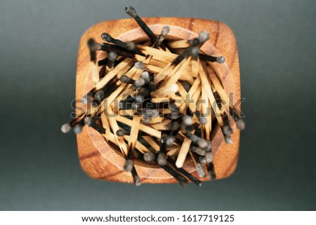 Burnt matches spiraled in a cup Royalty-Free Stock Photo #1617719125