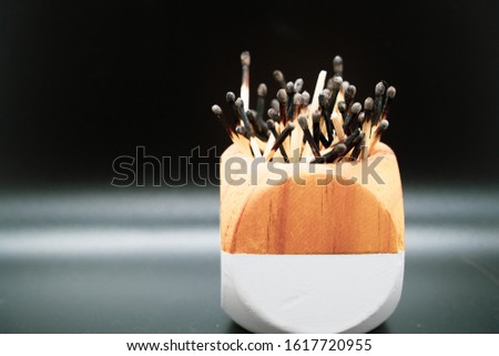 Burnt and used matches in a cup Royalty-Free Stock Photo #1617720955