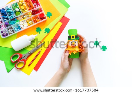 Leprechaun paper craft. St.Patrick 's Day. Four leaf clover green. Material for creativity. Children's creativity