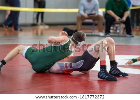 High School wrestlers competing at a wrestling meet