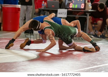High School wrestlers competing at a wrestling meet