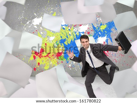 Composite image of smiling attractive businessman in a hurry