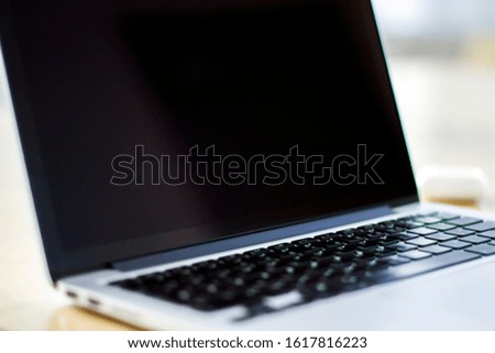Close up of blank laptop screen with keyboard