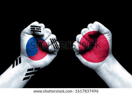 South Korea and Japan conflict, international relations crisis, flag on human hand background concept 