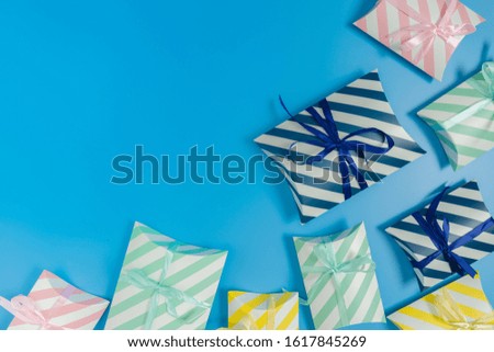 the variety of gift boxes put on the bottom right of a picture on a blue background