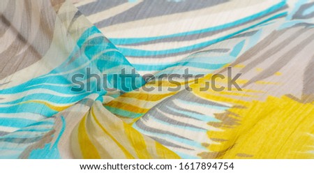 texture background pattern. Silk fabric with colored lace. Yellow blue and gray-blue shades. It is perfect for your design, accents, wallpapers, posters and postcards. Your possibilities are endless