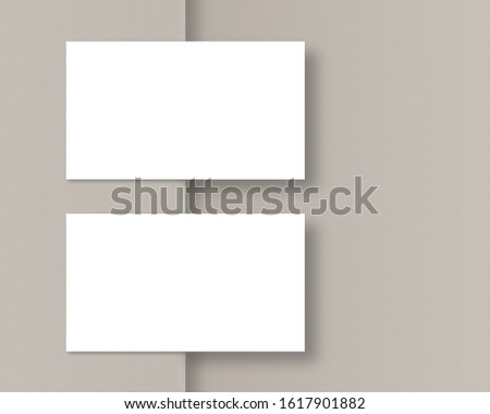 Mockup of two horizontal business cards. Business card mockup with soft shadow. Mockup scene. Top view. Template for branding identity. Photo mockup with clipping path.