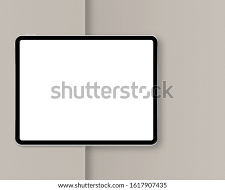 Modern tablet with blank white screen. Horizontal tablet mockup with soft shadow. Top view. Photo mockup with clipping path.