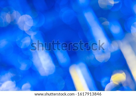 Dark blue background with light effects and white, yellow and bright lens flares