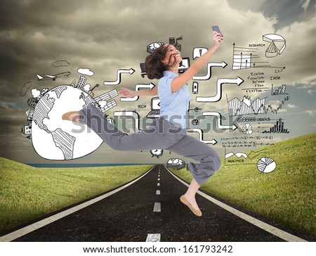 Composite image of happy classy businesswoman jumping while holding smartphone on white background 