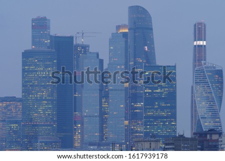 Towers of Moscow City in winter evening fog. Moscow city structure: modern buildings of MIBC (Moscow International Business Center). High resolution photography.