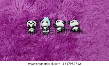 Lined Pandas are Sleeping on a Purple Background