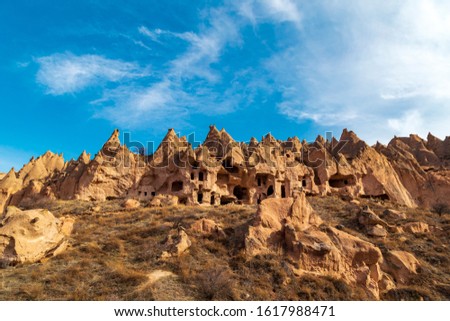 Panaromic view of the National Park of Zelve Valley, Nevsehir, Cappadocia, Turkey. Rock Formations in Zelve Valley. Royalty-Free Stock Photo #1617988471