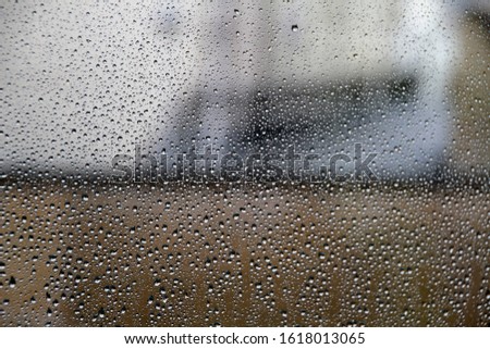 Drops on a window in a rainy day