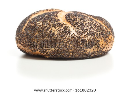 Bread roll covered with poppy seeds, typical German breakfast food. Studio shot, cutout, isolated on white background.