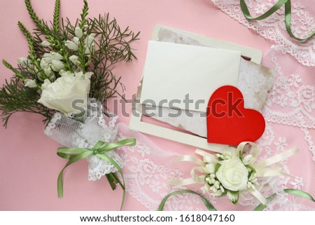 Valentine's day greeting card. small bouquet of flowers, red heart and space for text