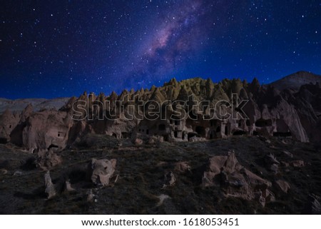 Milkyway sky view of the National Park of Zelve Valley, Nevsehir, Cappadocia, Turkey. Rock Formations in Zelve Valley. Royalty-Free Stock Photo #1618053451
