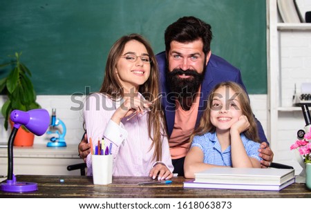 Extra classes. Gifted child. Little girl studying with team of tutors. Private lesson with tutors. Home tutoring concept. Tutors and afterschool programs. Individual approach. Tutor for excellence. Royalty-Free Stock Photo #1618063873
