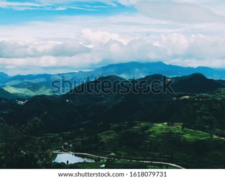 Layers of terraced fields, houses sheltered in the mountains, changing clouds, constitute a beautiful picture.