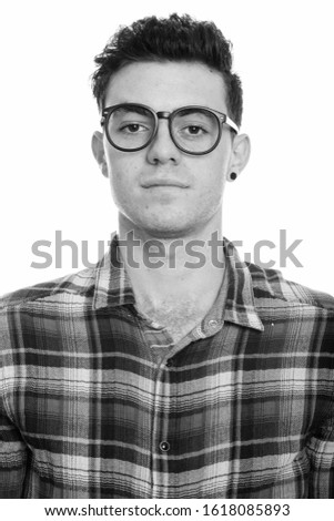 Portrait of young handsome hipster man in black and white