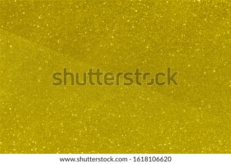 Gold and golden yellow glitter glow abstract. Glittering shimmer bright luxury. White and silver glow for texture wallpaper and background backdrop.
