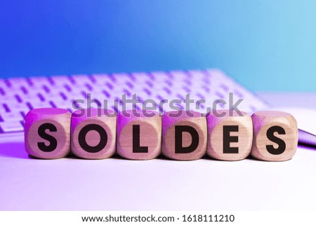 
SALES written on cubes in front of a keyboard and a mouse
