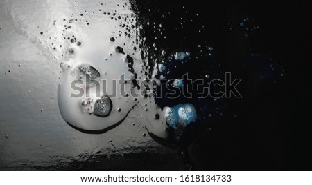 Reflection of colors in water, space, cosmos concept isolated on black background, effect nebula texture 
