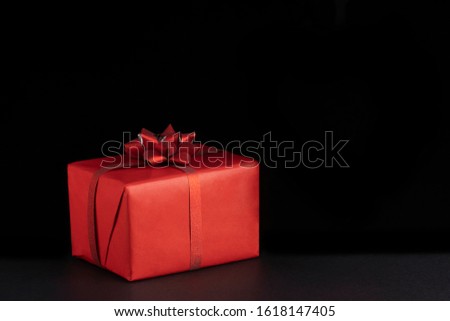 Valentine day concept. Red Christmas gift presents on black background. Greeeting card, postcard. Copy space Royalty-Free Stock Photo #1618147405