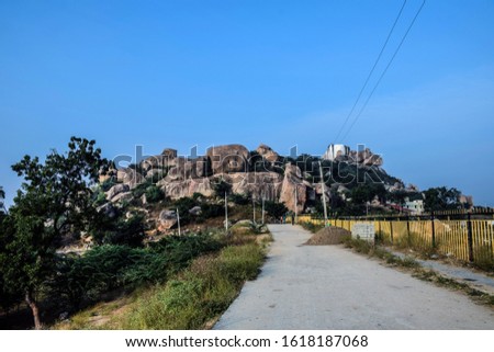 Stock photo of big rocks standing without any support on the ancient hindu temple hills, lord mallayya temple situated in the top of the hill. Picture captured at yadgir , mailapur, Karnataka, India.