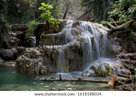 Part of the Krushuna waterfall cascade of river Proinovska near village Krushuna, Bulgaria. They are famous with their landscape and are formed by many travertines and turquoise blue water. 