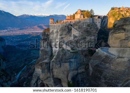 The Meteora. Is a rock formation in central Greece hosting one of the largest and most precipitously built complexes of Eastern Orthodox monasteries.