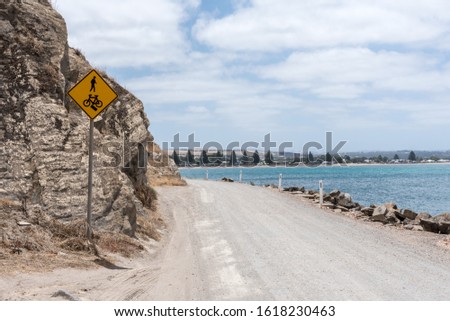 Gravel Coastal Road with Warning Signs - bike & pedestrian warning - Victor Harbor, South Australia 