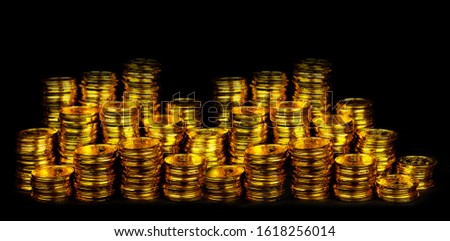 Stacking gold coin in treasure stack at black background